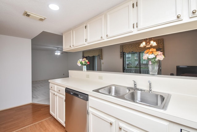 14911 Wunderlich Dr Unit 211, Houston, TX 77069 - kitchen featuring dishwasher, light countertops, white cabinets, and light wood-type flooring