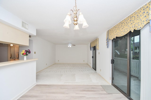 14911 Wunderlich Dr Unit 211, Houston, TX 77069 - hallway with a chandelier and light wood finished floors