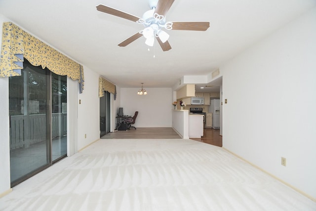 14911 Wunderlich Dr Unit 211, Houston, TX 77069 - unfurnished living room featuring carpet, ceiling fan, and a chandelier