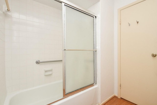14911 Wunderlich Dr Unit 211, Houston, TX 77069 - full bathroom featuring bath / shower combo with glass door and wood finished floors