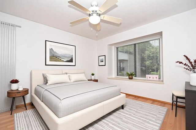 14911 Wunderlich Dr Unit 211, Houston, TX 77069 - bedroom featuring light wood-type flooring and ceiling fan