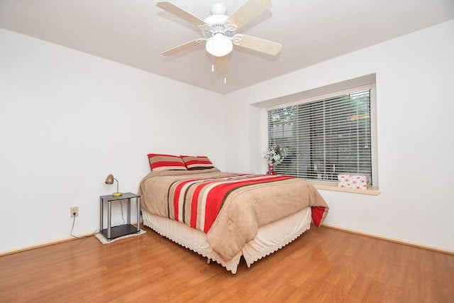14911 Wunderlich Dr Unit 211, Houston, TX 77069 - bedroom with wood finished floors and ceiling fan