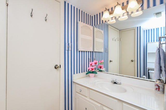 14911 Wunderlich Dr Unit 211, Houston, TX 77069 - bathroom featuring wallpapered walls and vanity