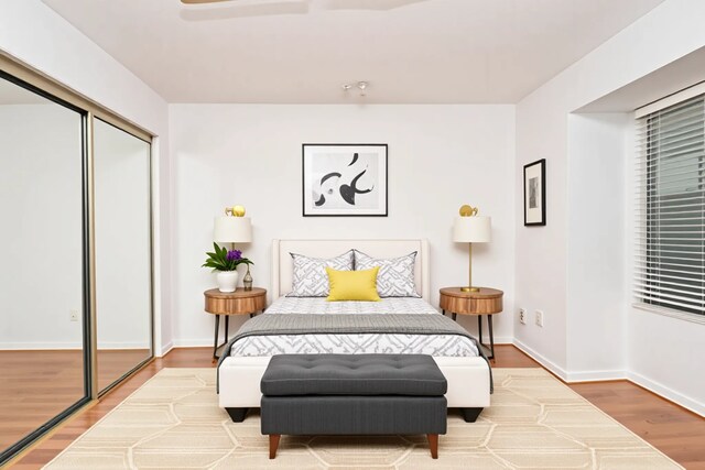 14911 Wunderlich Dr Unit 211, Houston, TX 77069 - bedroom with wood finished floors and a closet