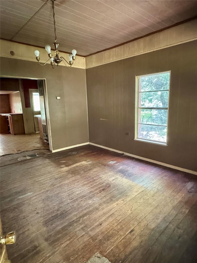193 Corry Jones, Livingston, TX 77351 - spare room featuring wood-type flooring, a chandelier, and wooden ceiling