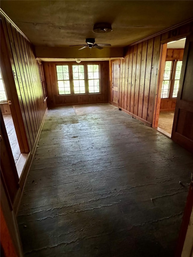 193 Corry Jones, Livingston, TX 77351 - unfurnished room with plenty of natural light, ceiling fan, and wooden walls