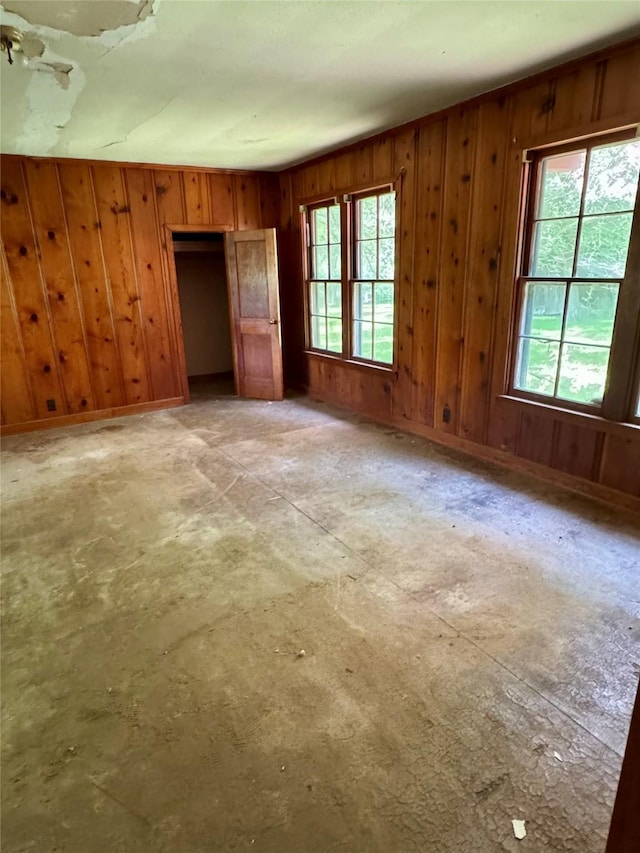 193 Corry Jones, Livingston, TX 77351 - unfurnished bedroom featuring wooden walls