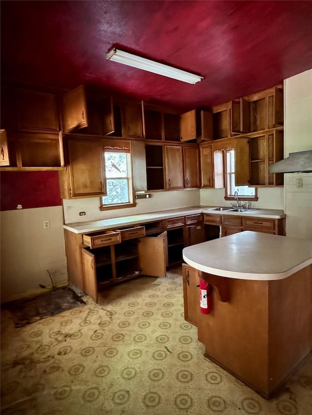 193 Corry Jones, Livingston, TX 77351 - kitchen with open shelves, light countertops, brown cabinets, and light flooring