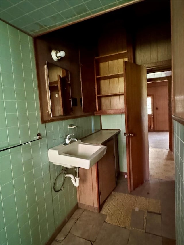 193 Corry Jones, Livingston, TX 77351 - bathroom featuring tile walls and a sink