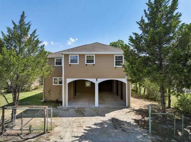 127 Metzwright Dr, Anahuac, TX 77514 - coastal inspired home with dirt driveway and a carport