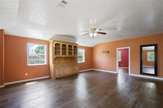127 Metzwright Dr, Anahuac, TX 77514 - unfurnished living room with a ceiling fan, a textured ceiling, and dark wood finished floors