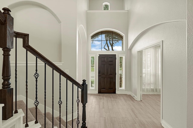 20010 Barrow Edge Ln, Cypress, TX 77433 - foyer entrance with healthy amount of natural light, wood finished floors, a high ceiling, and stairs