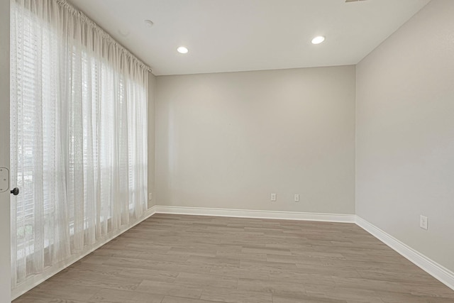 20010 Barrow Edge Ln, Cypress, TX 77433 - spare room with light wood-type flooring and recessed lighting