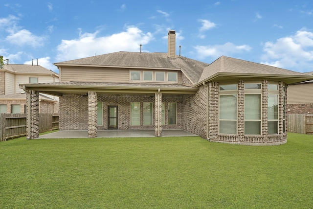 20010 Barrow Edge Ln, Cypress, TX 77433 - back of property with a patio area, brick siding, and roof with shingles