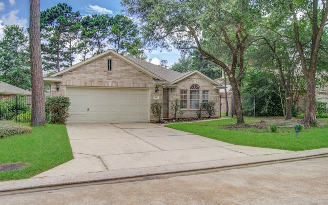 99 E Foxbriar Forest Cir, The Woodlands, TX 77382 - ranch-style house featuring brick siding, concrete driveway, a garage, and roof with shingles