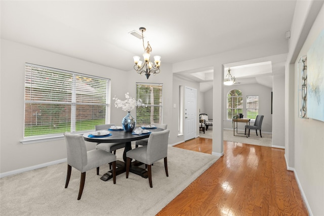 99 E Foxbriar Forest Cir, The Woodlands, TX 77382 - dining area with a chandelier and wood finished floors