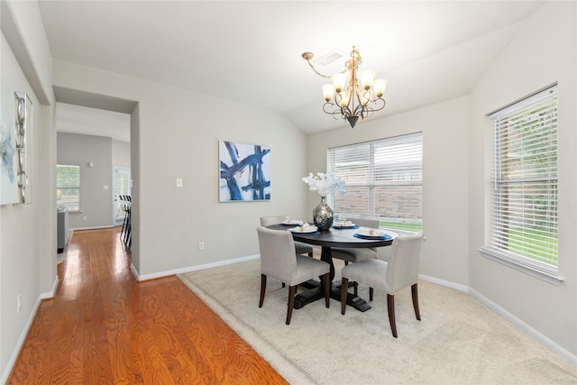 99 E Foxbriar Forest Cir, The Woodlands, TX 77382 - dining space featuring a chandelier, healthy amount of natural light, wood finished floors, and lofted ceiling