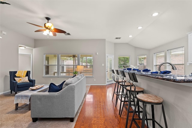 99 E Foxbriar Forest Cir, The Woodlands, TX 77382 - living room with vaulted ceiling, a ceiling fan, recessed lighting, and light wood finished floors