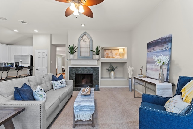 99 E Foxbriar Forest Cir, The Woodlands, TX 77382 - living area featuring light colored carpet, ceiling fan, a fireplace, and recessed lighting