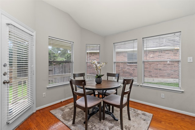 99 E Foxbriar Forest Cir, The Woodlands, TX 77382 - dining room featuring lofted ceiling and wood finished floors