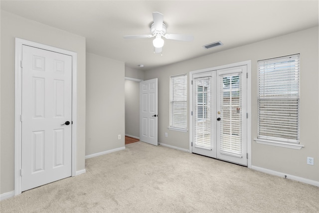 99 E Foxbriar Forest Cir, The Woodlands, TX 77382 - unfurnished bedroom featuring french doors, access to outside, carpet, and ceiling fan
