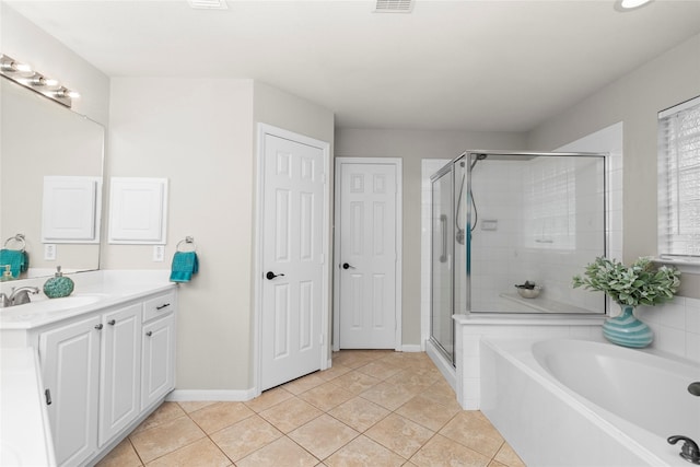 99 E Foxbriar Forest Cir, The Woodlands, TX 77382 - bathroom with vanity, a shower stall, a bath, and tile patterned flooring