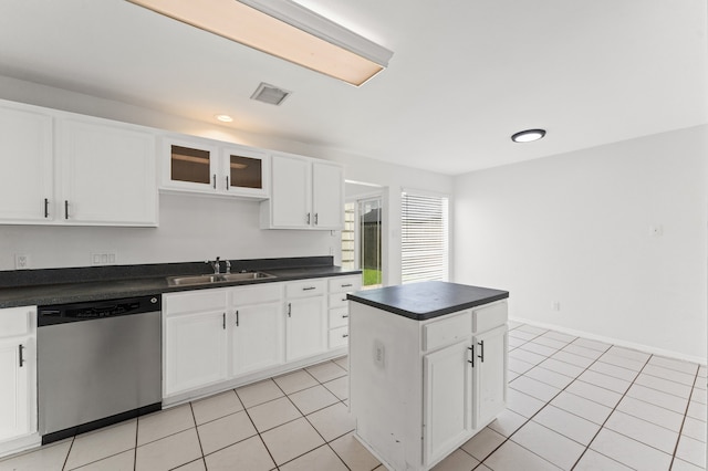 16323 Tiburon Way, Houston, TX 77053 - kitchen with dishwasher, dark countertops, white cabinets, a kitchen island, and glass insert cabinets