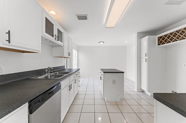 16323 Tiburon Way, Houston, TX 77053 - kitchen with stainless steel dishwasher, dark countertops, white cabinetry, and recessed lighting