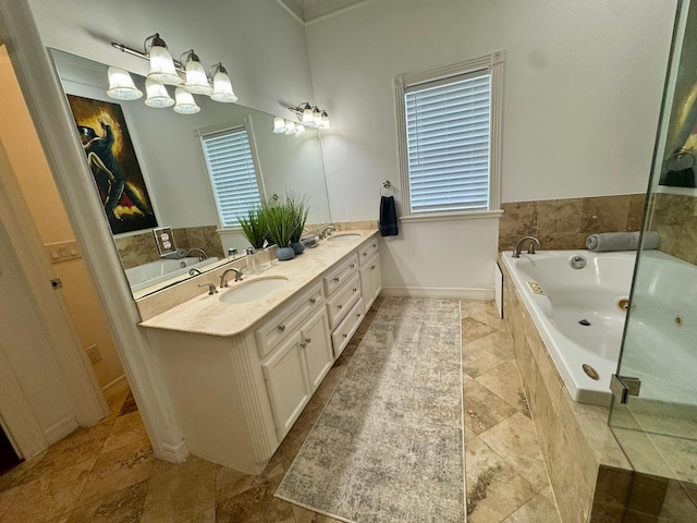 1812 Prospect St, Houston, TX 77004 - bathroom featuring double vanity, a garden tub, healthy amount of natural light, and ornamental molding