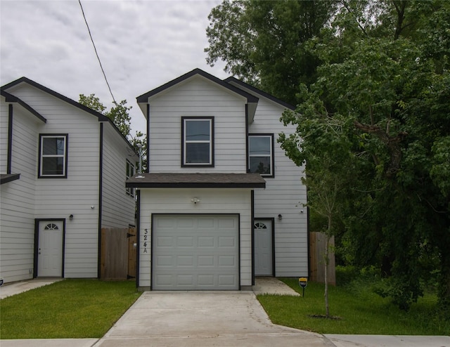 324 Gans St Unit B, Houston, TX 77029 - view of front facade featuring a garage and driveway