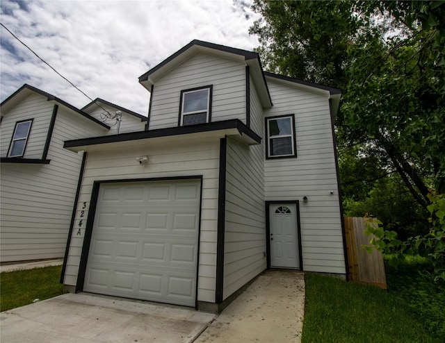 324 Gans St Unit B, Houston, TX 77029 - view of front of property with a garage and driveway