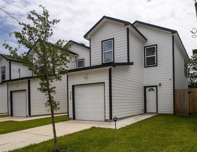 324 Gans St Unit B, Houston, TX 77029 - view of front facade featuring driveway and an attached garage