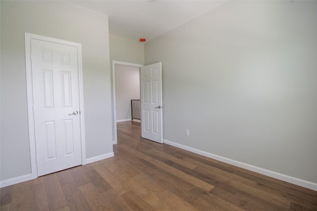 324 Gans St Unit B, Houston, TX 77029 - unfurnished bedroom with wood finished floors and baseboards