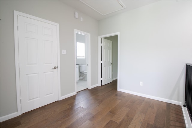 324 Gans St Unit B, Houston, TX 77029 - spare room with dark wood-style floors and attic access