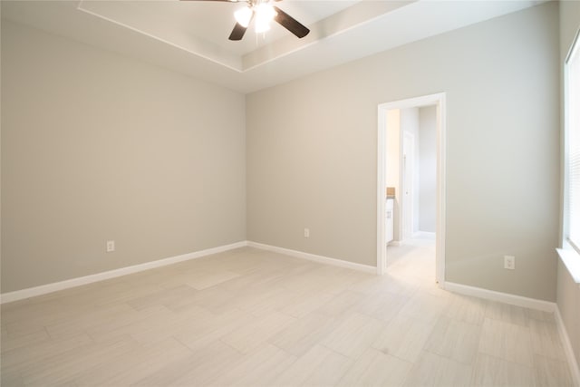 324 Gans St Unit B, Houston, TX 77029 - empty room with a ceiling fan and a tray ceiling