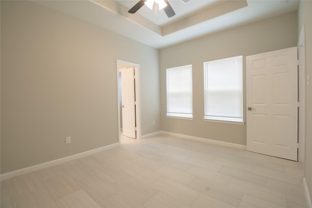 324 Gans St Unit B, Houston, TX 77029 - empty room featuring ceiling fan and a raised ceiling