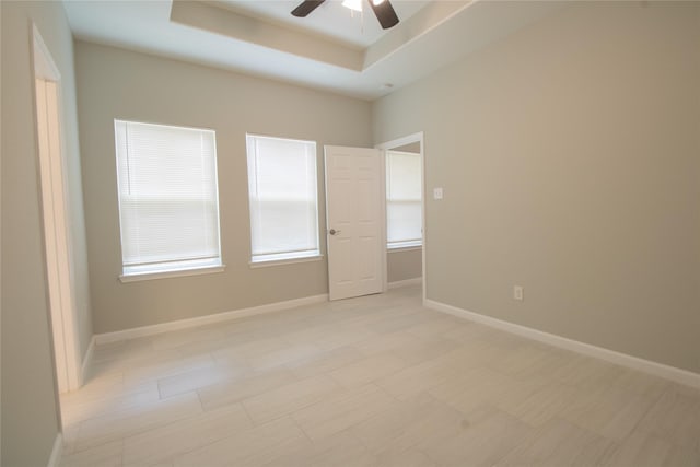 324 Gans St Unit B, Houston, TX 77029 - empty room with ceiling fan and a tray ceiling