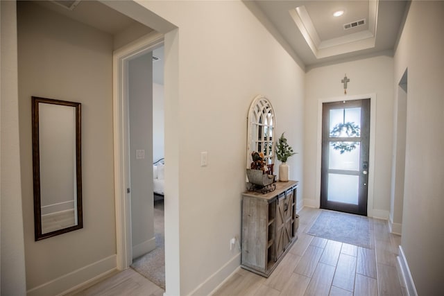 15138 Botanical Garden Dr, Conroe, TX 77302 - entrance foyer featuring a raised ceiling and light wood finished floors