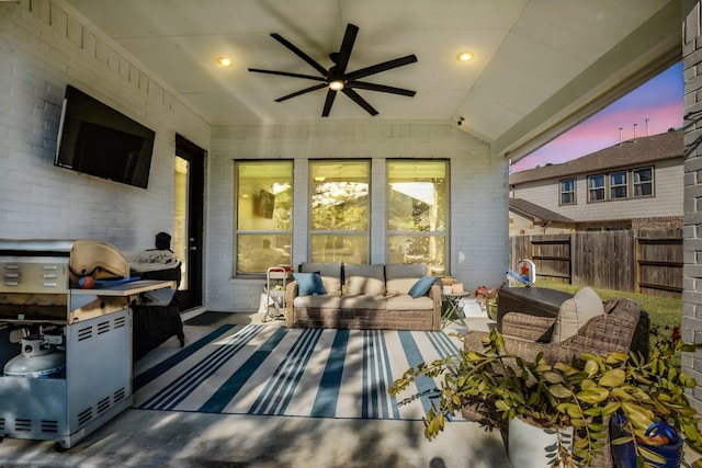 15138 Botanical Garden Dr, Conroe, TX 77302 - patio terrace at dusk with outdoor lounge area and ceiling fan