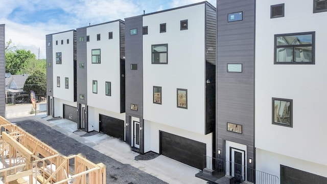 315 N Nagle St, Houston, TX 77003 - view of building exterior with an attached garage