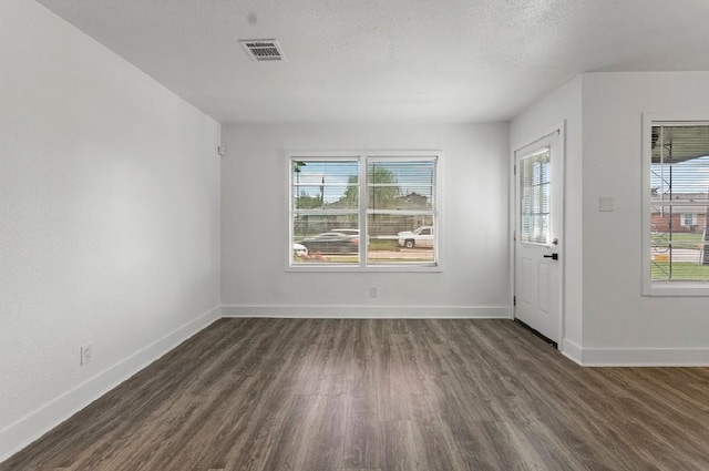 4303 Dacca Dr, Houston, TX 77047 - empty room with wood finished floors and a textured ceiling