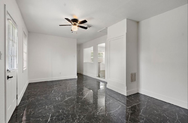 4303 Dacca Dr, Houston, TX 77047 - empty room featuring ceiling fan and marble tiled flooring
