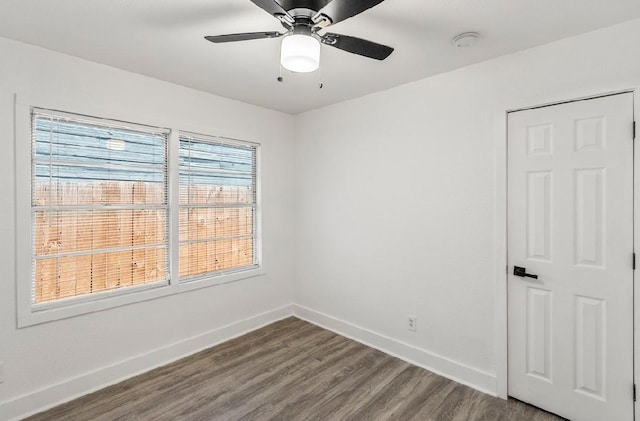 4303 Dacca Dr, Houston, TX 77047 - unfurnished room with a smoke detector, dark wood-type flooring, and a ceiling fan