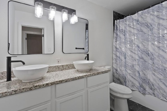 4303 Dacca Dr, Houston, TX 77047 - bathroom with double vanity and toilet