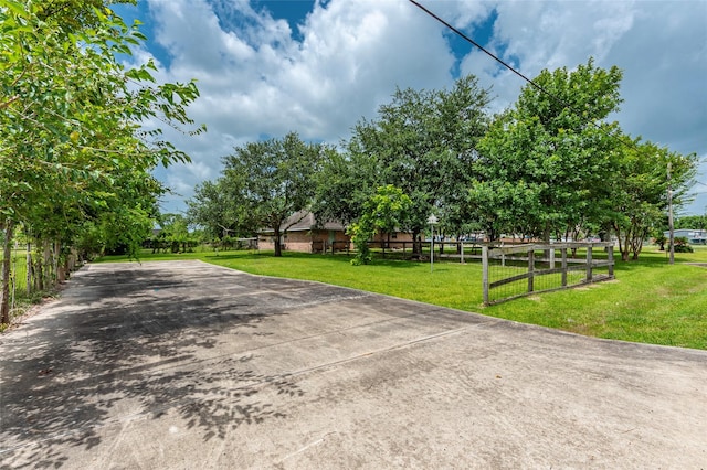 15631 Fir Rd, Santa Fe, TX 77517 - view of concrete driveway