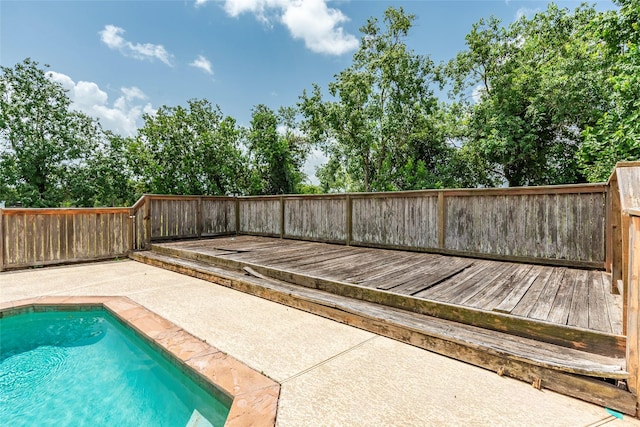 15631 Fir Rd, Santa Fe, TX 77517 - view of pool with a patio, a wooden deck, and a fenced backyard