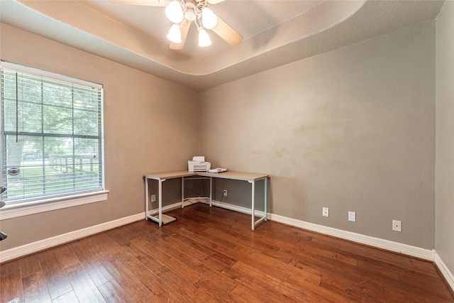 15631 Fir Rd, Santa Fe, TX 77517 - unfurnished office featuring dark wood-style floors, a raised ceiling, and a ceiling fan