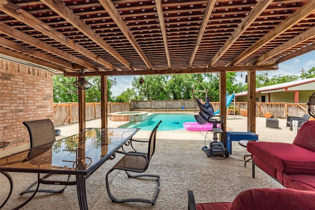 15631 Fir Rd, Santa Fe, TX 77517 - fenced backyard featuring an in-ground hot tub and a patio area