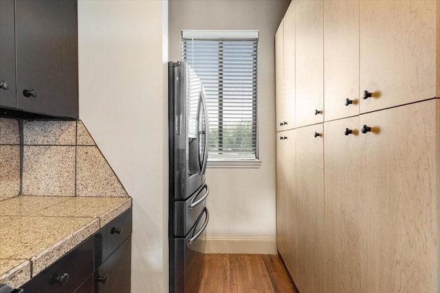 1020 Columbus St, Houston, TX 77019 - washroom featuring baseboards and wood finished floors