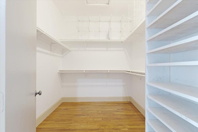 1020 Columbus St, Houston, TX 77019 - walk in closet with wood finished floors